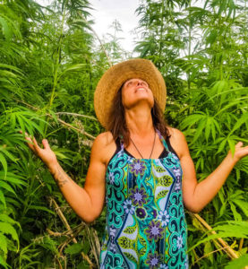 Winona Laduke standing in hemp field.