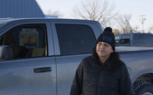 woman in front of truck
