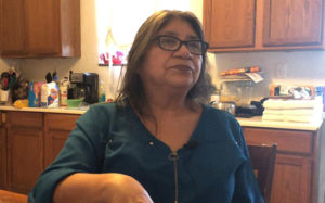 woman sitting at kitche table