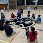 sports kids with sticks